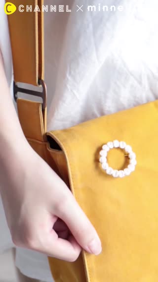 色合いがとてもやさしい、綿の糸でつくった「まるブローチ」